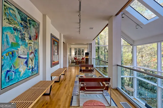 a view of balcony with wooden floor and fence