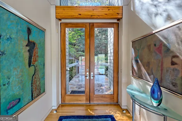 a kitchen with sink a stove and a wooden floors