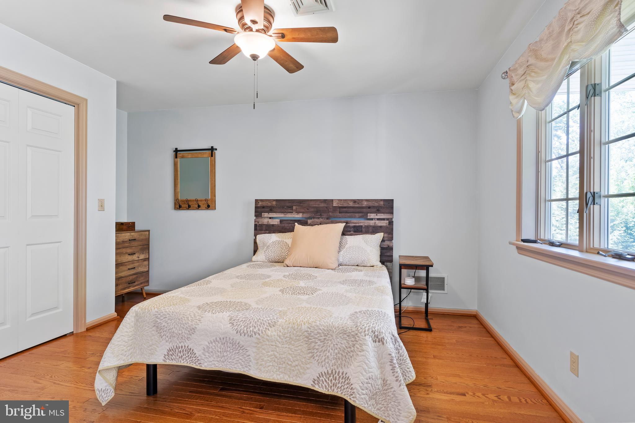 176 Richland Road Carlisle, PA 17015 - Photo 33 of 59 a bedroom with a bed and wooden floor