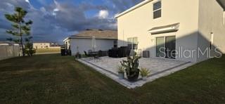 2771 Common Fig Run Wesley Chapel, FL 33543 - Photo 16 of 16 a view of a porch with plants and a yard