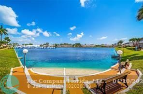 725 Southwest 11th Avenue, Unit 6F Hallandale Beach, FL 33009 - Photo 11 of 12 a view of a backyard with swimming pool