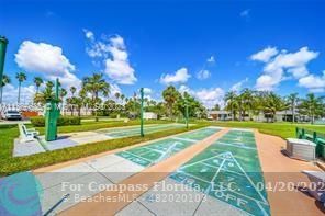 725 Southwest 11th Avenue, Unit 6F Hallandale Beach, FL 33009 - Photo 12 of 12 a view of a playground with a swimming pool
