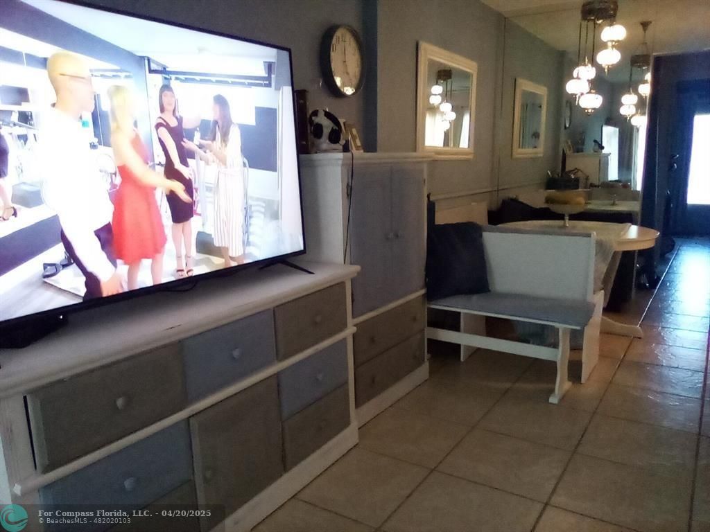 725 Southwest 11th Avenue, Unit 6F Hallandale Beach, FL 33009 - Photo 6 of 12 a view of kitchen with furniture and lamp