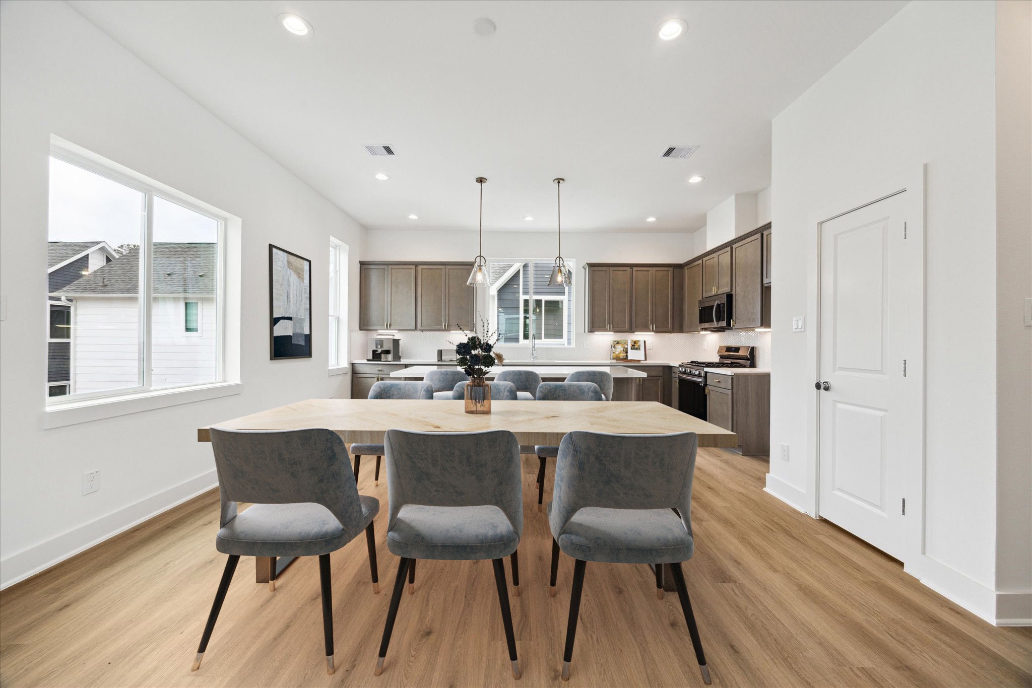 1650 West Tidwell Road Houston, TX 77091 - Photo 1 of 18 a dining room with stainless steel appliances kitchen island granite countertop a dining table chairs and granite counter tops