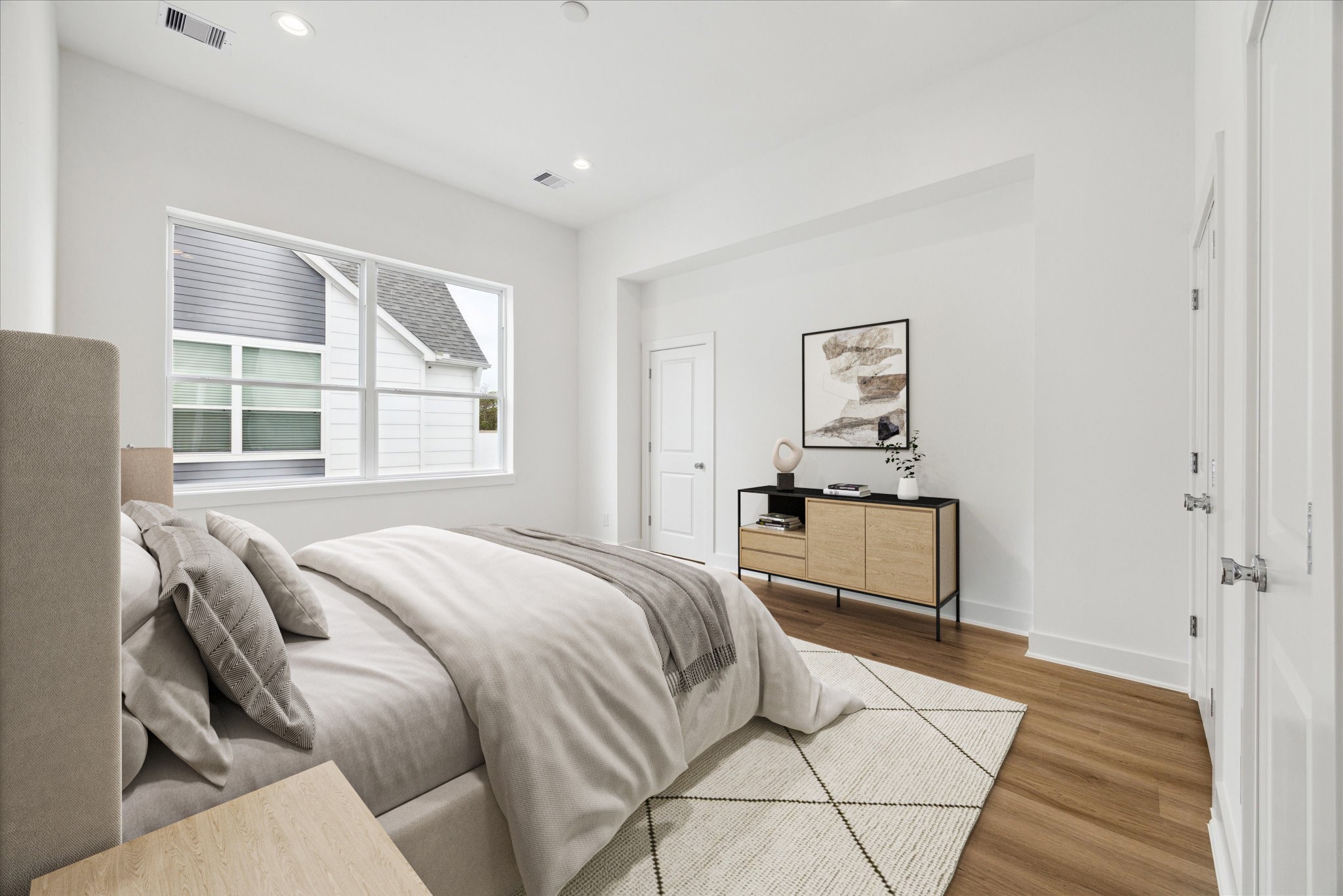 1650 West Tidwell Road Houston, TX 77091 - Photo 15 of 18 a bedroom with a bed and a window