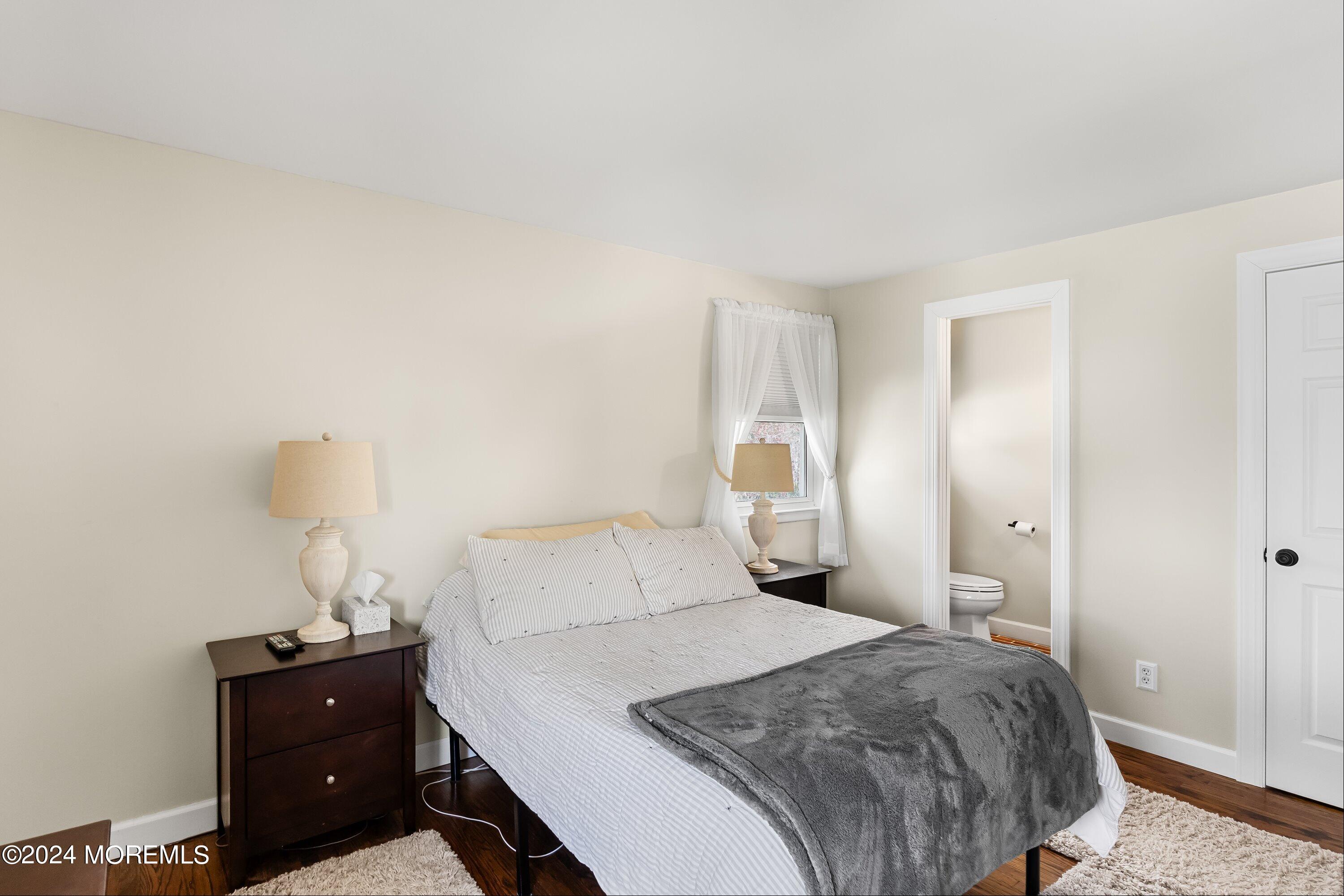 325 Ithaca Avenue Delran, NJ 08075 - Photo 12 of 19 a bedroom with a bed and a lamp