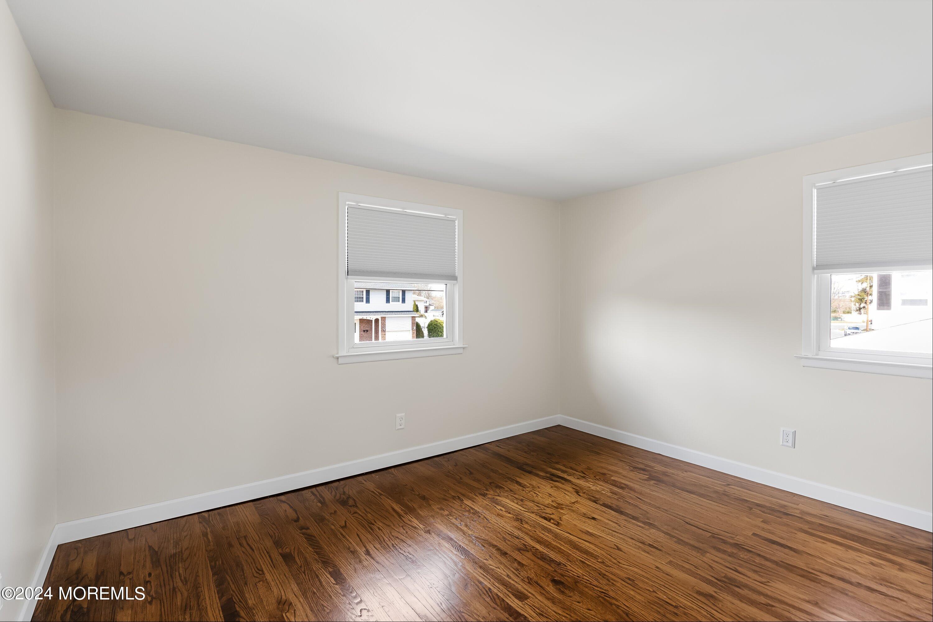325 Ithaca Avenue Delran, NJ 08075 - Photo 13 of 19 an empty room with wooden floor and windows