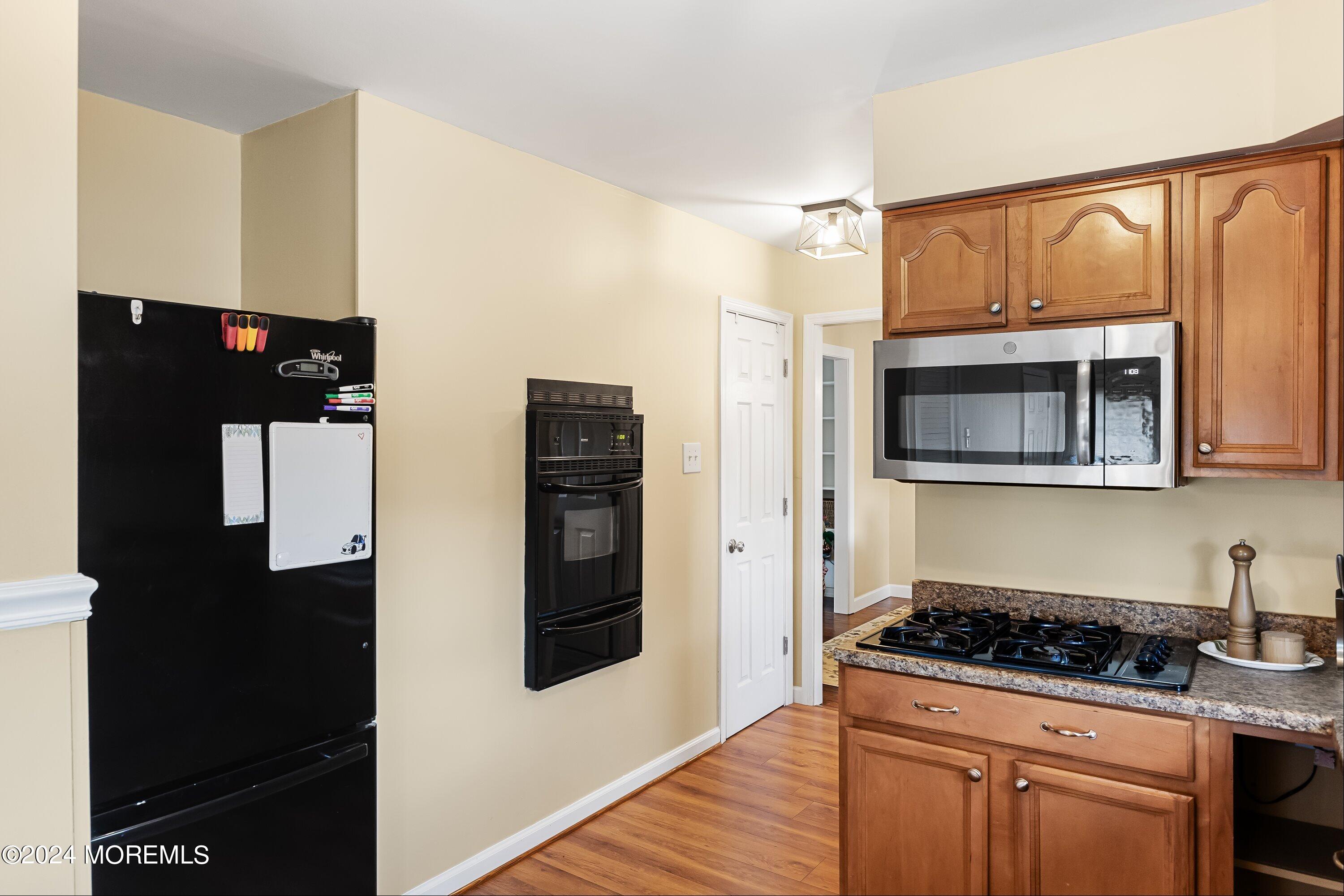 325 Ithaca Avenue Delran, NJ 08075 - Photo 8 of 19 a kitchen with stainless steel appliances granite countertop a stove and a refrigerator