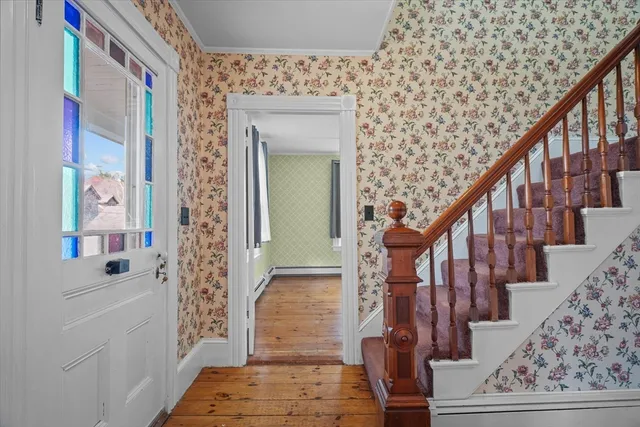 a view of entryway with wooden floor