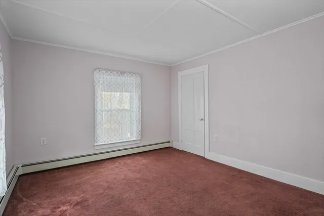 an empty room with a empty space and window