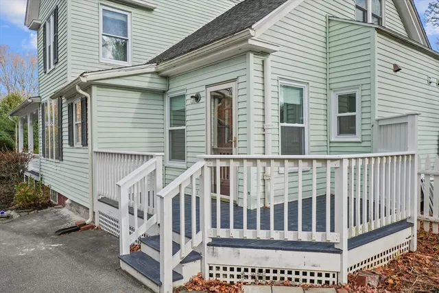 a view of a house with wooden fence