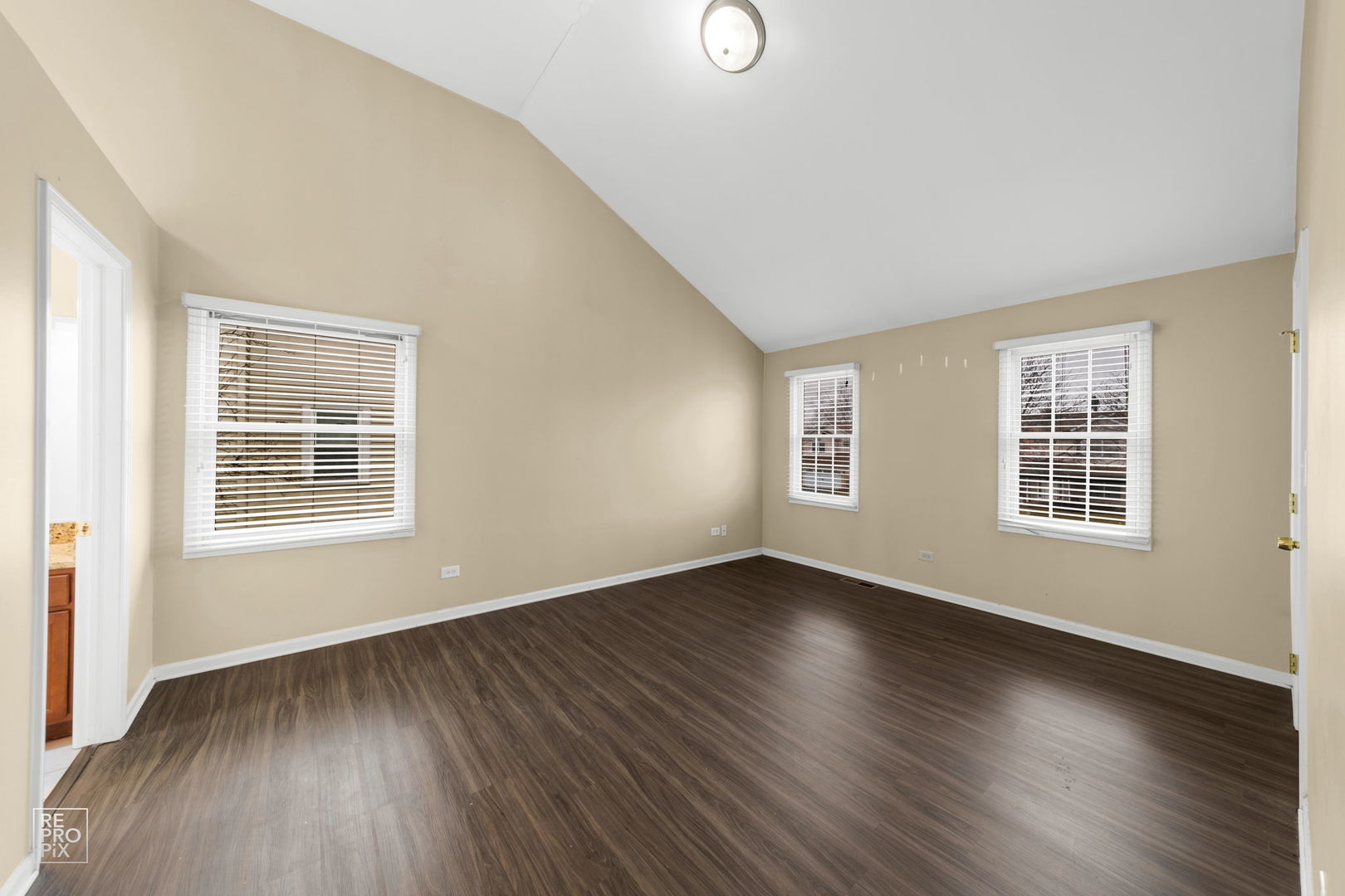 5519 Feather Creek Road Matteson, IL 60443 - Photo 15 of 26 a view of an empty room with wooden floor and a window