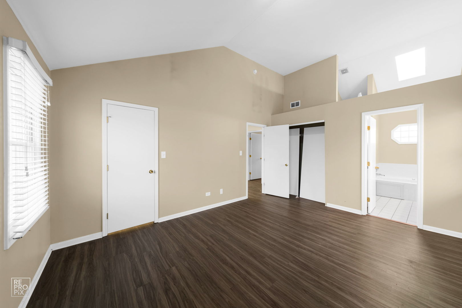 5519 Feather Creek Road Matteson, IL 60443 - Photo 16 of 26 an empty room with wooden floor and windows