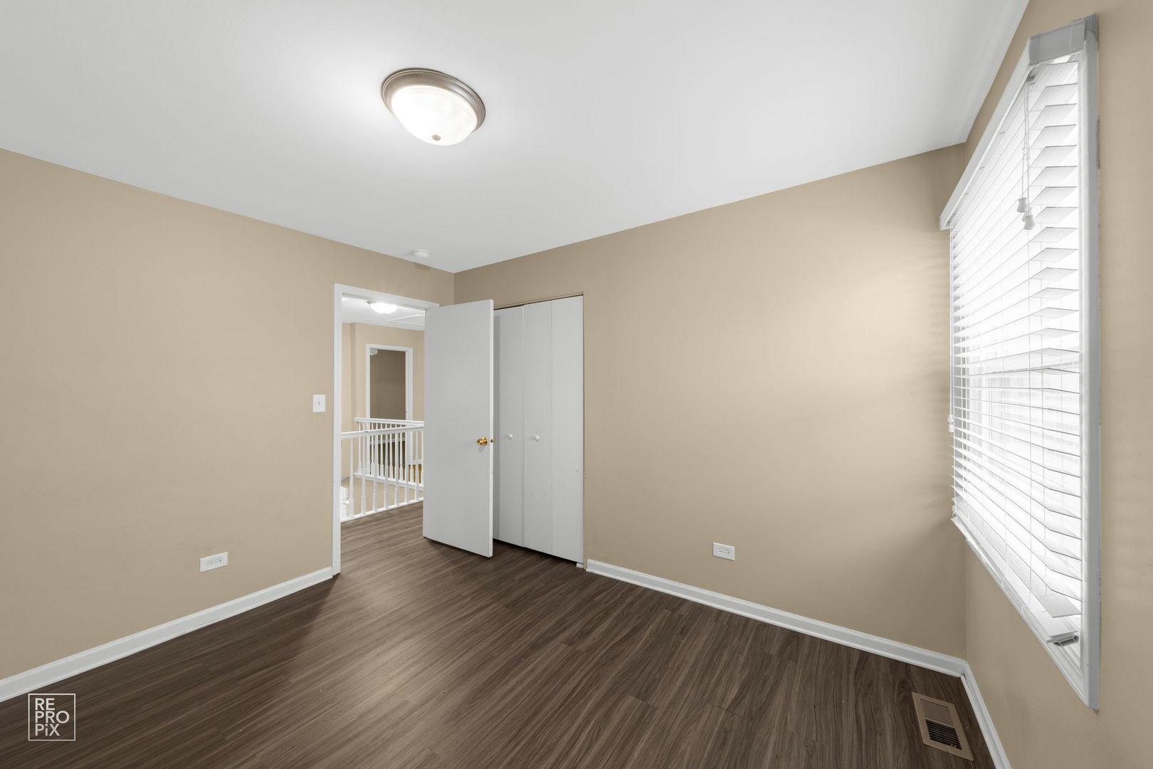 5519 Feather Creek Road Matteson, IL 60443 - Photo 19 of 26 a view of an empty room with wooden floor and a window