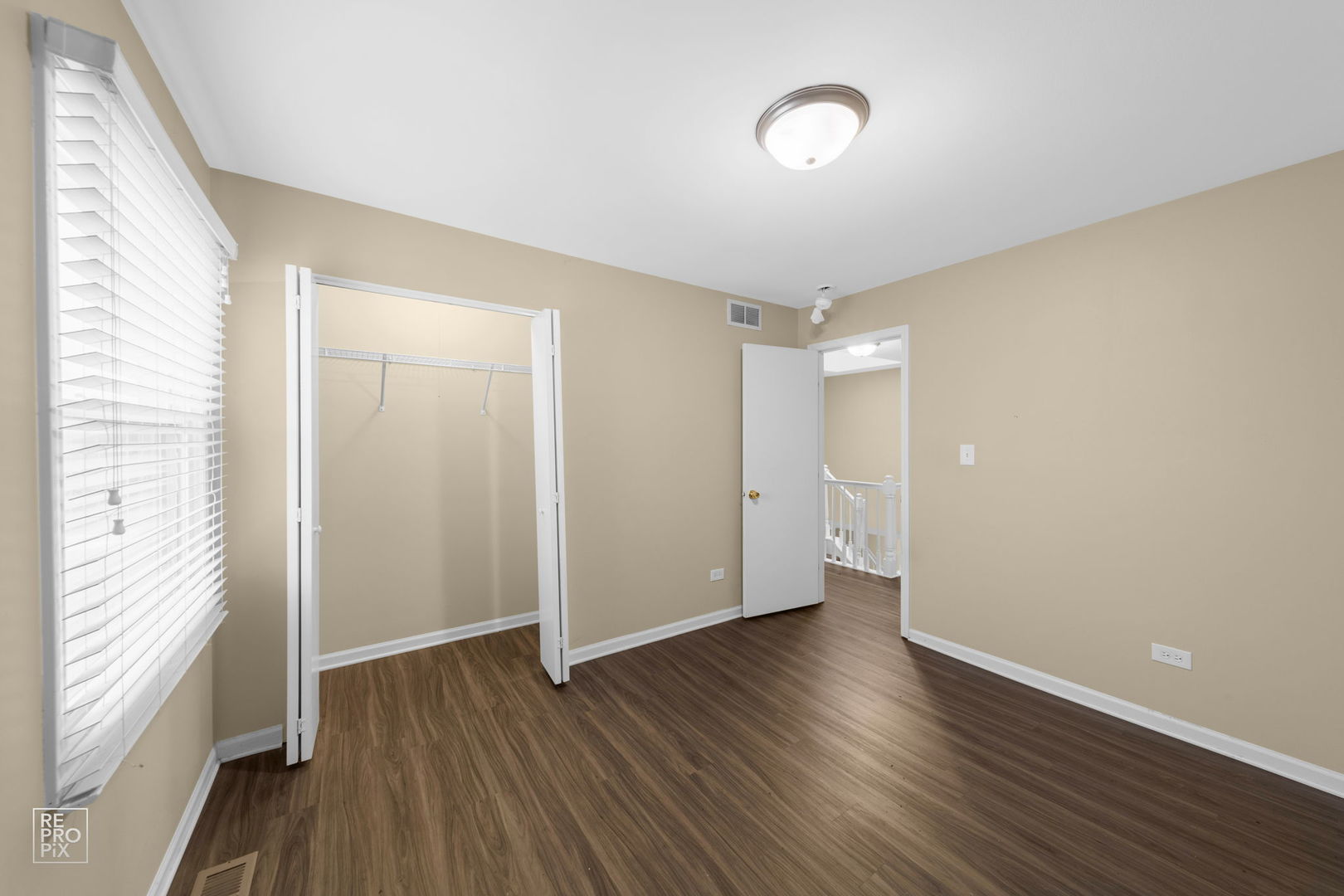 5519 Feather Creek Road Matteson, IL 60443 - Photo 20 of 26 a view of an empty room with wooden floor