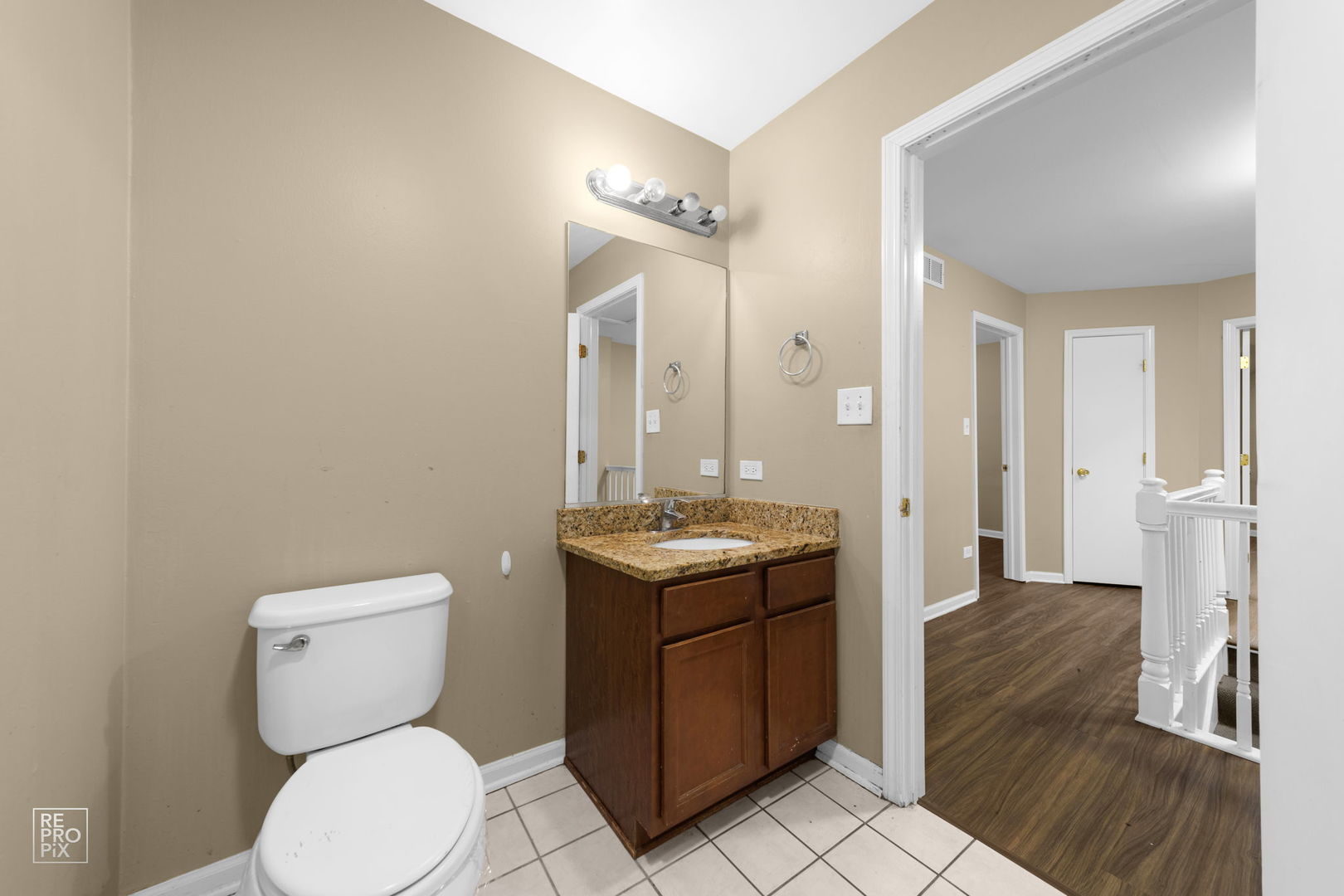 5519 Feather Creek Road Matteson, IL 60443 - Photo 23 of 26 a bathroom with a toilet sink and mirror