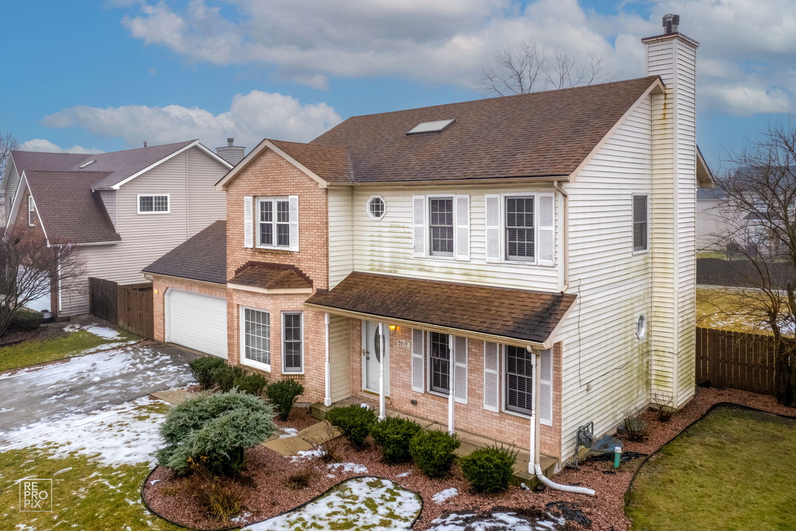 5519 Feather Creek Road Matteson, IL 60443 - Photo 3 of 26 a front view of a house with a yard and garage