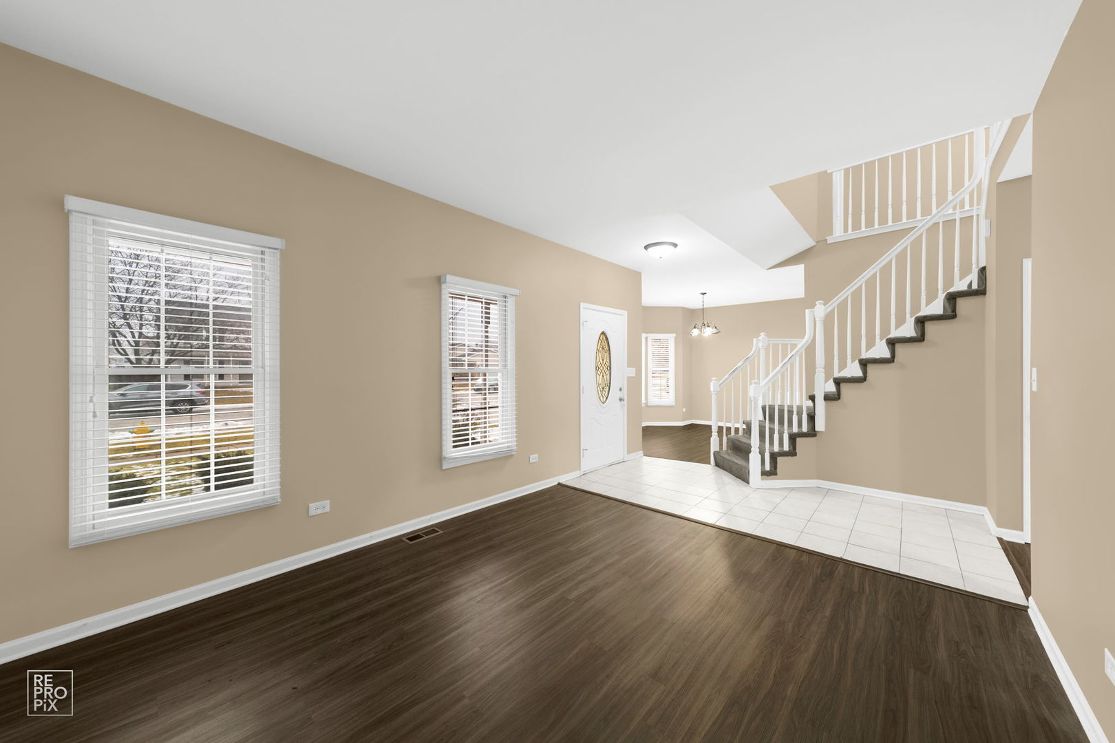 5519 Feather Creek Road Matteson, IL 60443 - Photo 7 of 26 a view of an empty room with wooden floor and a window