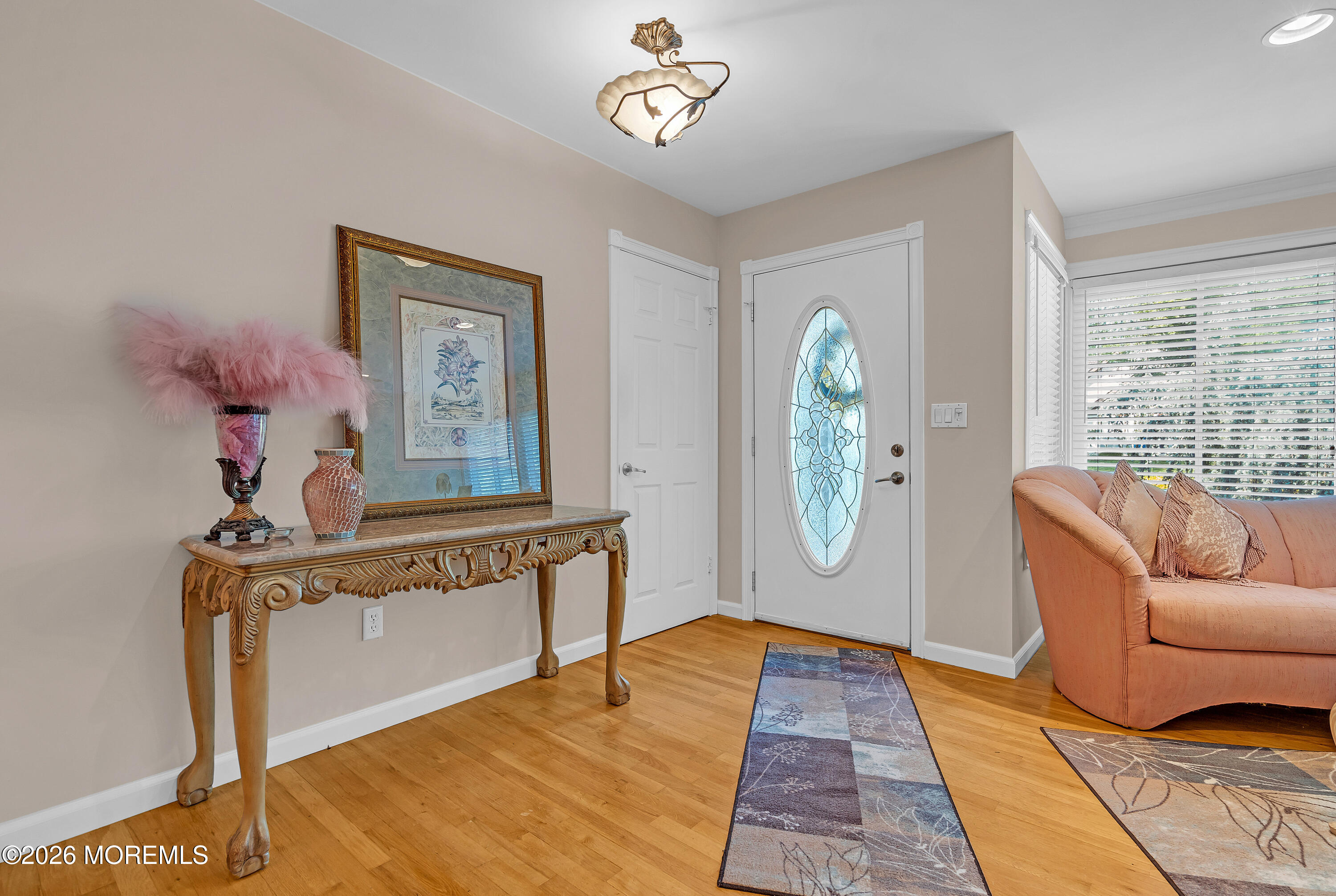 2 Apache Drive Toms River, NJ 08753 - Photo 16 of 75 a living room with furniture a chandelier and a window
