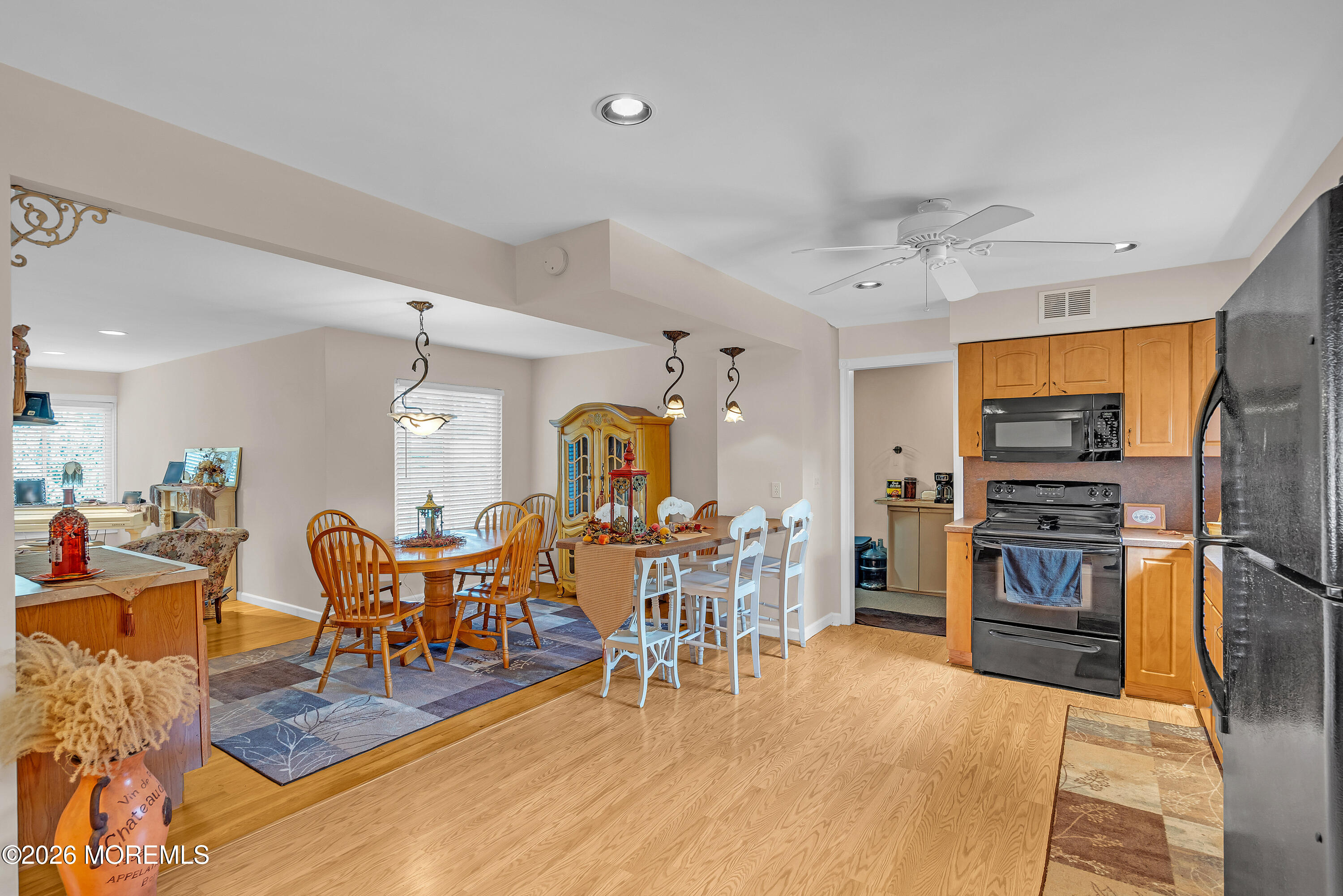 2 Apache Drive Toms River, NJ 08753 - Photo 26 of 75 a living room with furniture a dining table and chairs with kitchen view