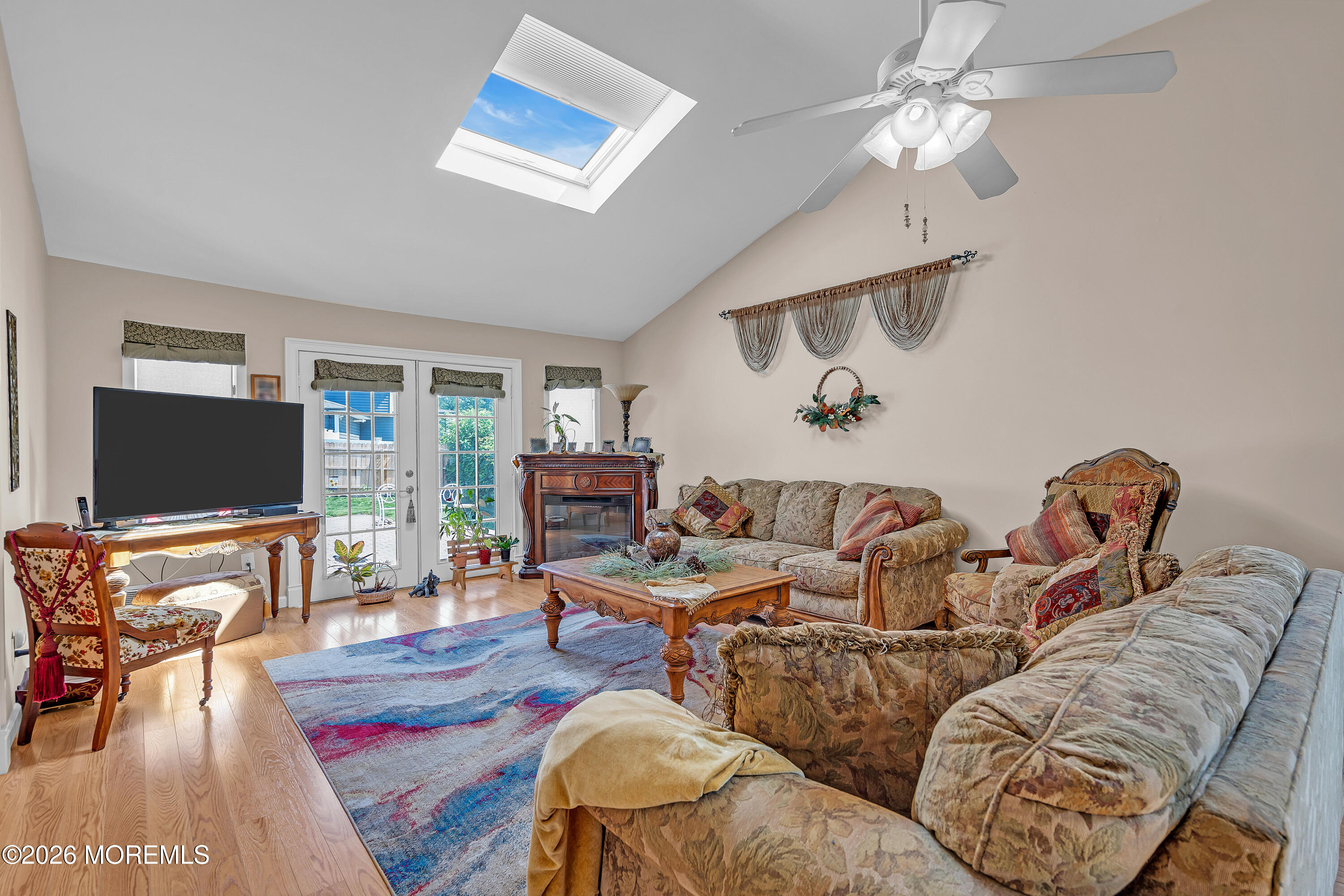 2 Apache Drive Toms River, NJ 08753 - Photo 37 of 75 a living room with furniture and a flat screen tv