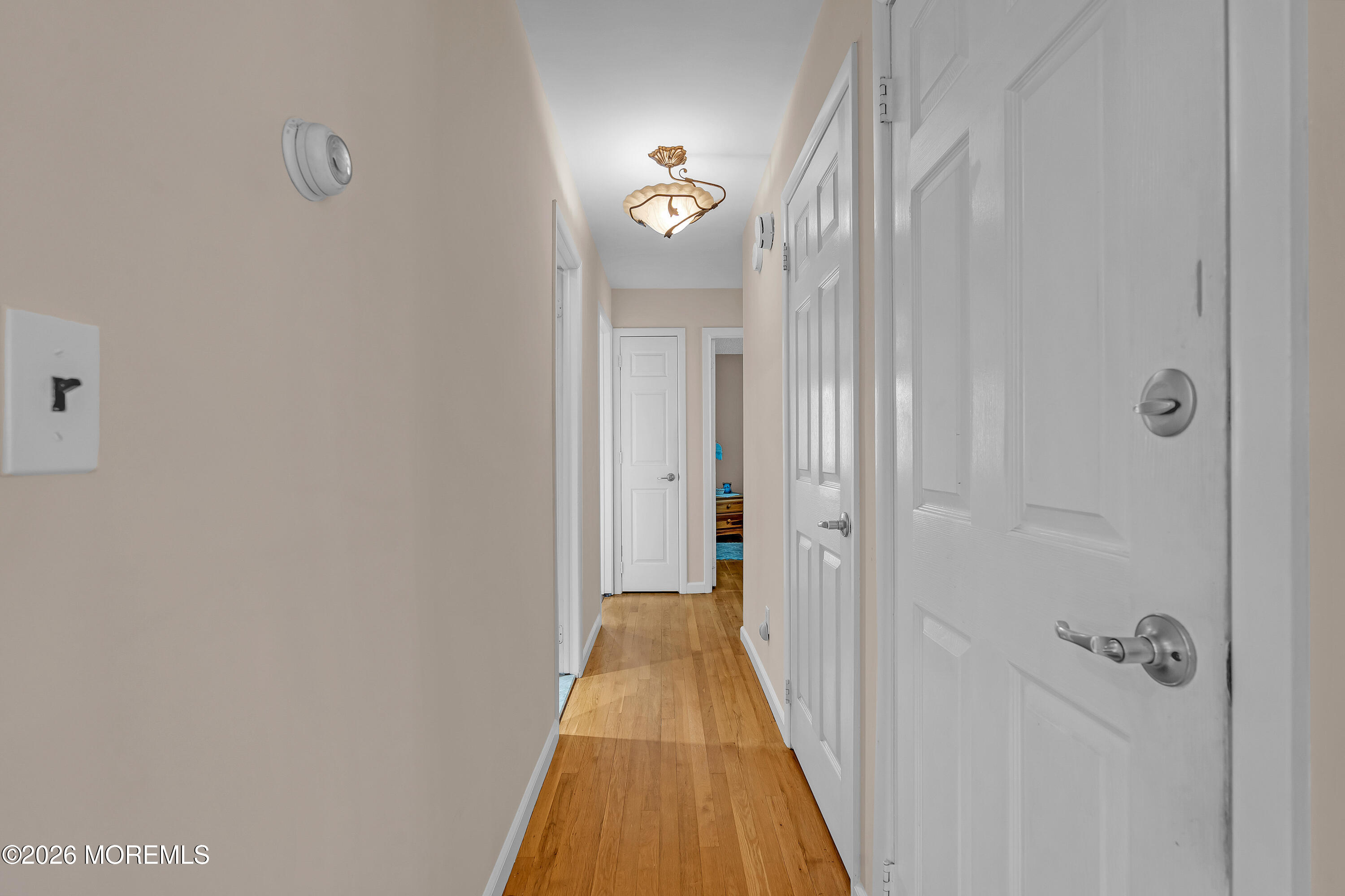 2 Apache Drive Toms River, NJ 08753 - Photo 46 of 75 a view of a hallway with wooden floor and a bathroom