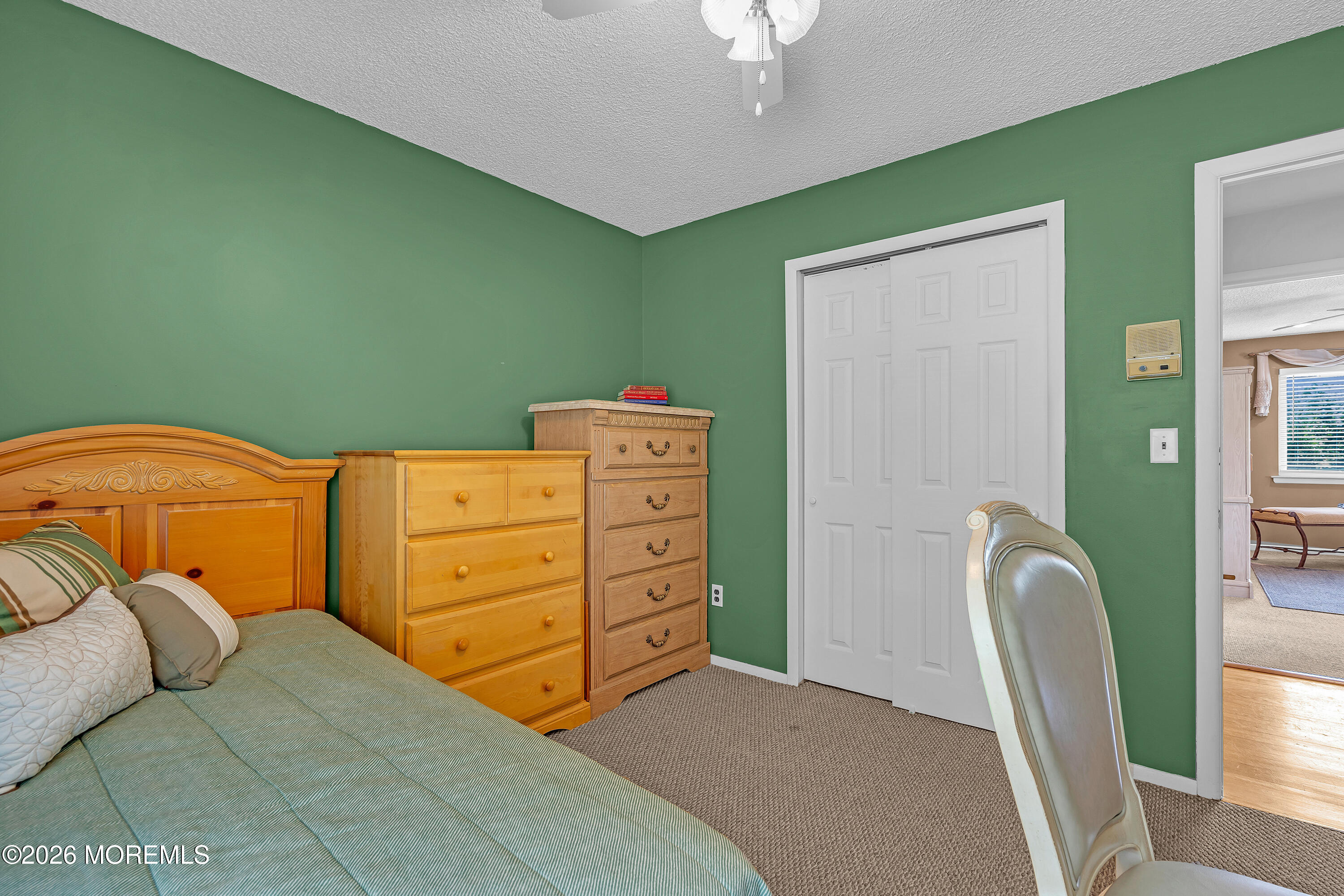 2 Apache Drive Toms River, NJ 08753 - Photo 55 of 75 a bedroom with a bed and a chandelier