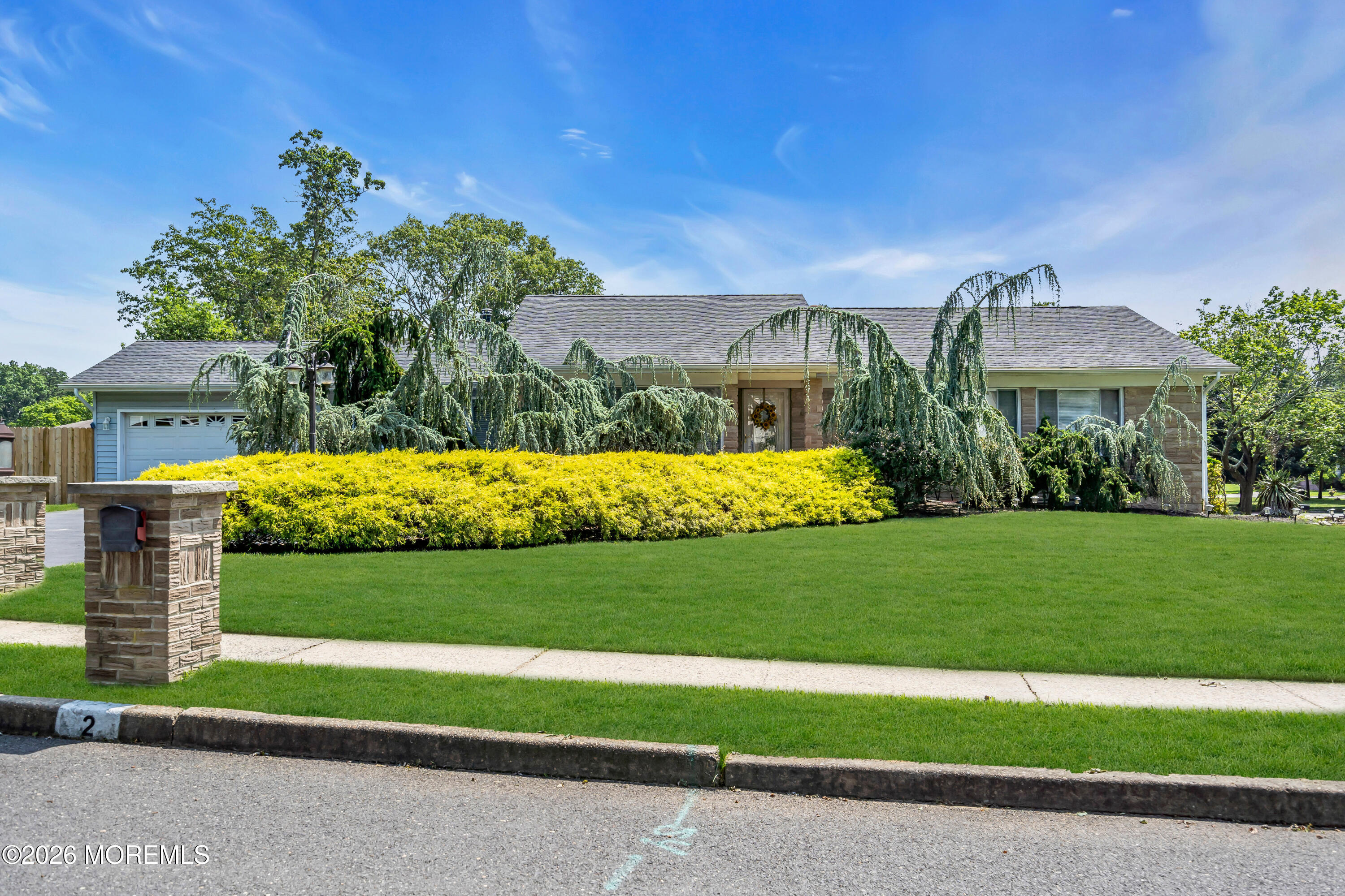 2 Apache Drive Toms River, NJ 08753 - Photo 8 of 75 a view of a house with a big yard and large trees