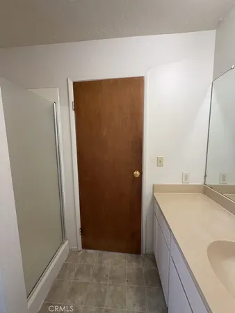 a bathroom with a sink and a granite countertop