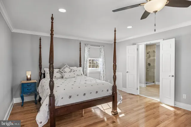 a bedroom with a bed and a table