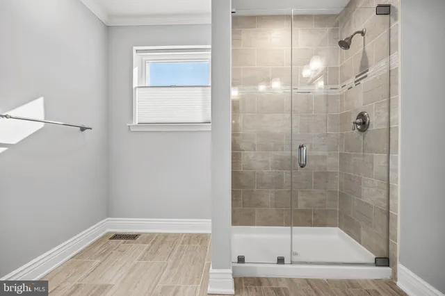 a bathroom with a bathtub and a shower