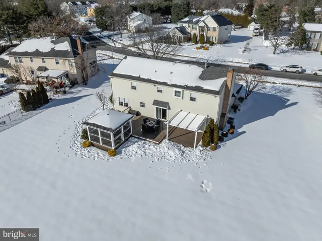 a view of yard from deck with patio