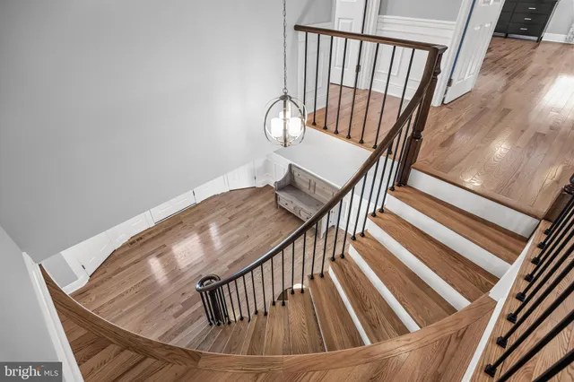 a view of staircase with wooden floor