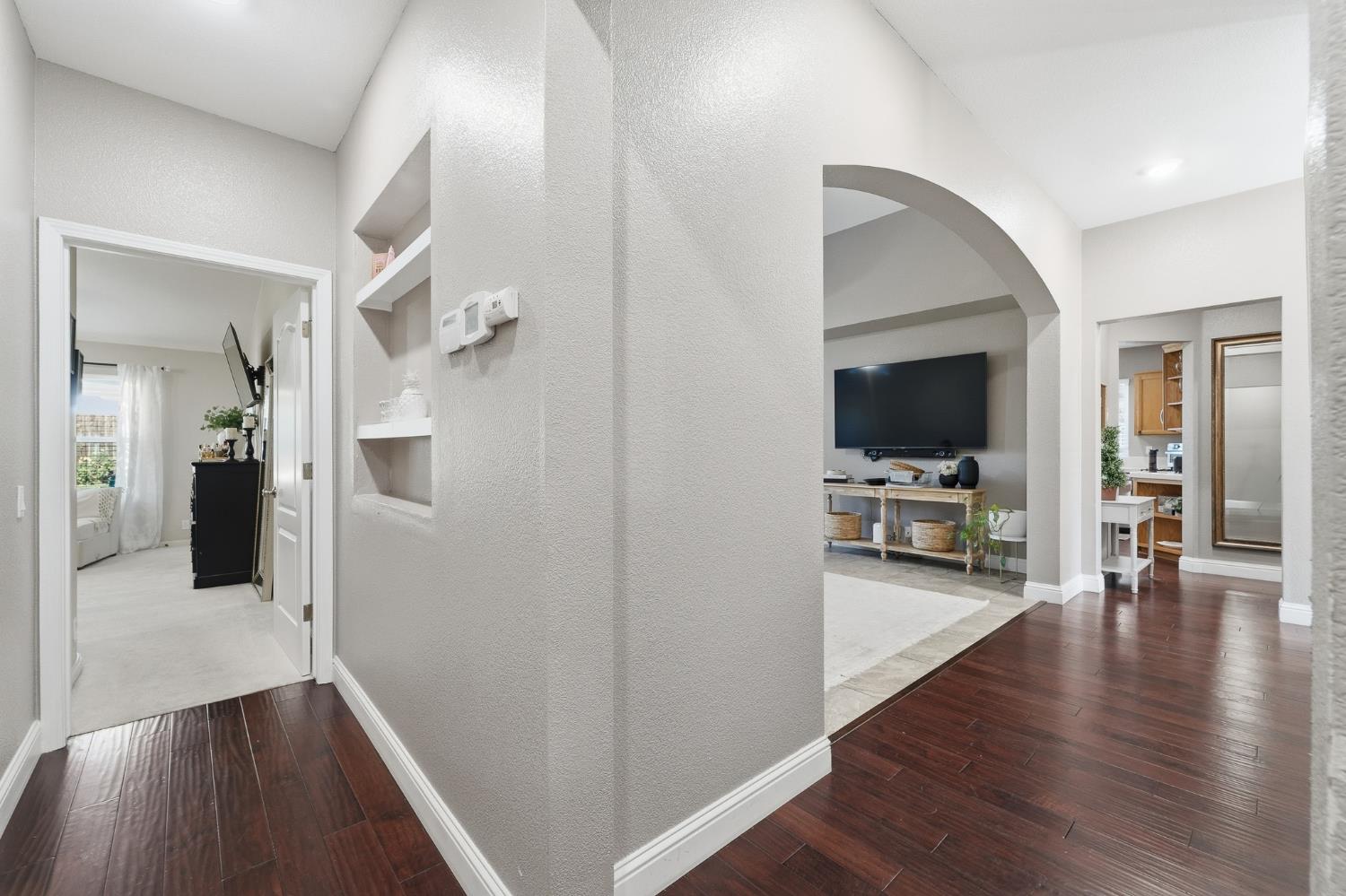 2220 Ellison Drive Modesto, CA 95355 - Photo 21 of 53 a view of a hallway view with wooden floor and furniture