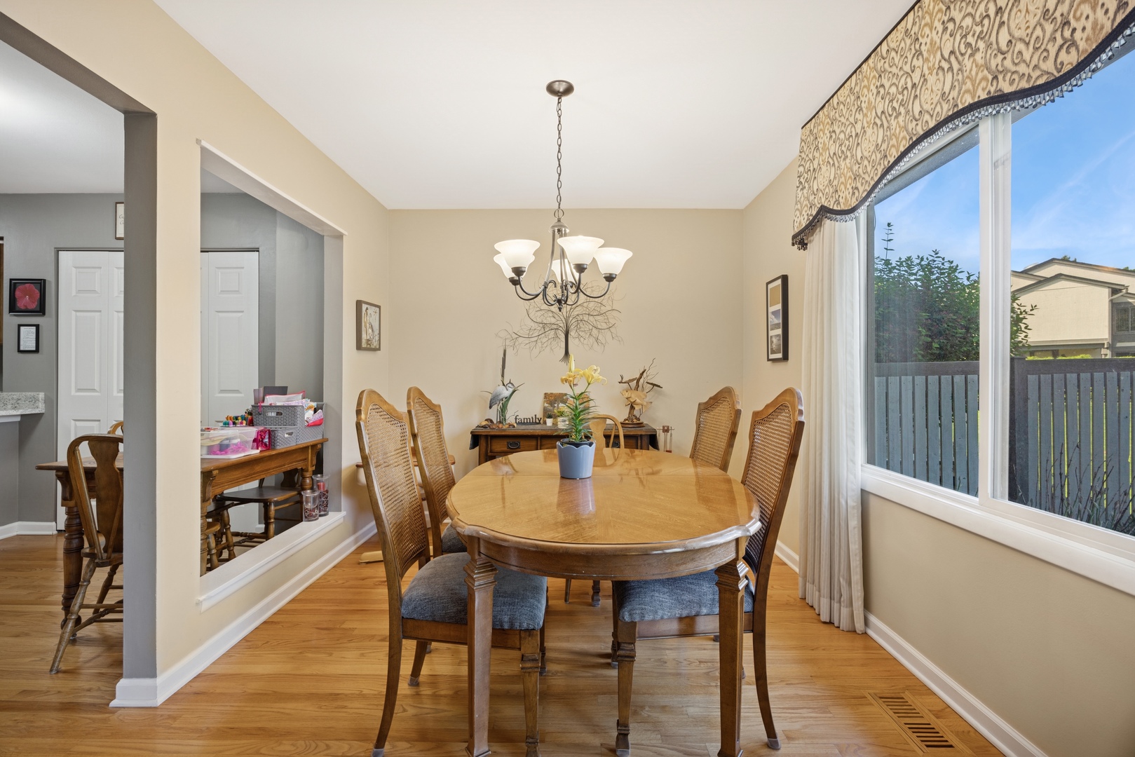 2618 Smith Street Rolling Meadows, IL 60008 - Photo 11 of 27 a view of a dining room with furniture wooden floor and a chandelier