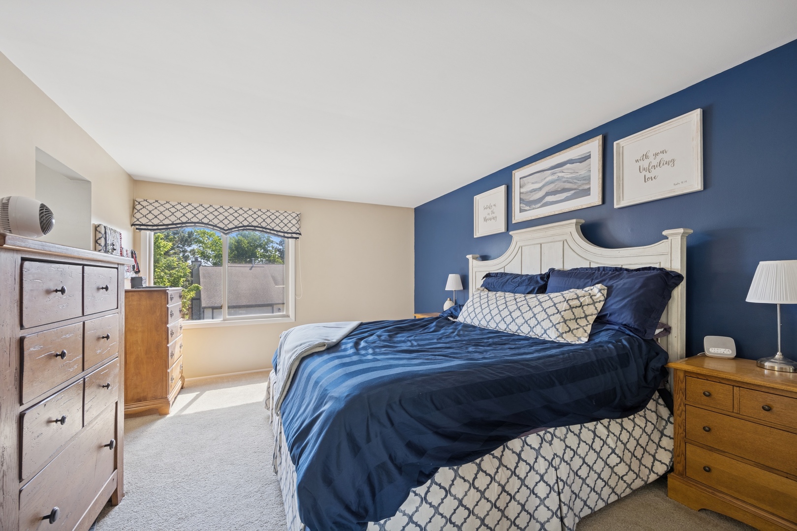 2618 Smith Street Rolling Meadows, IL 60008 - Photo 14 of 27 a bedroom with a bed and dresser with mirror