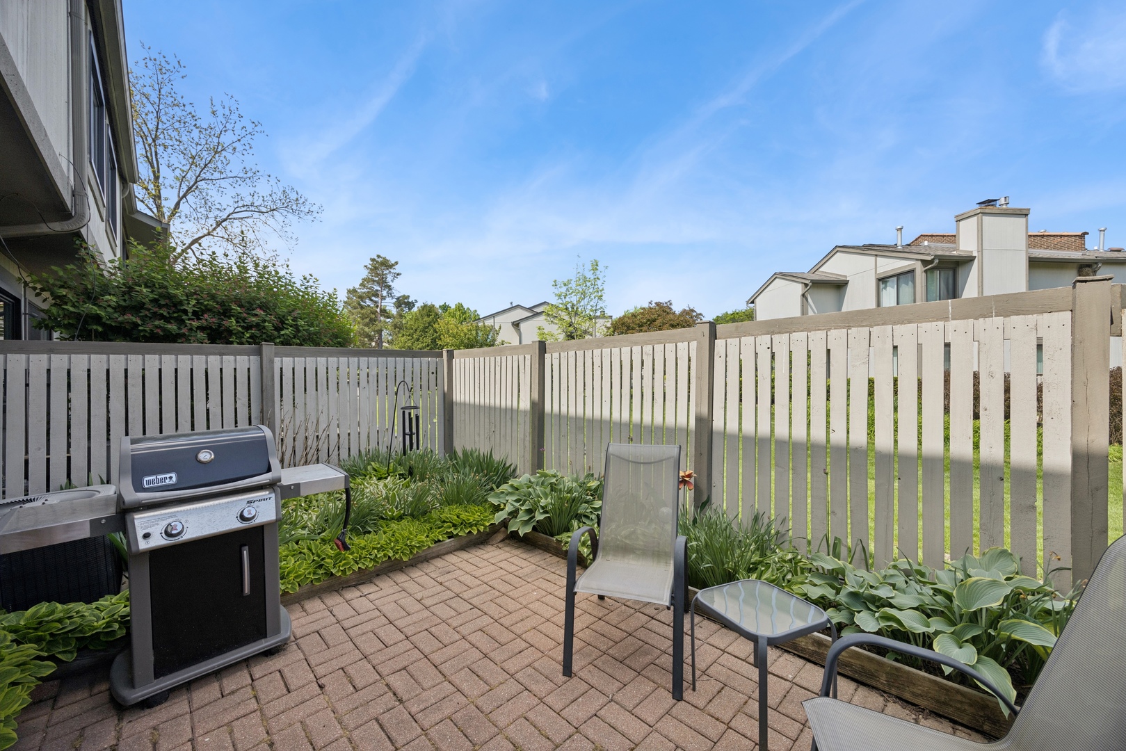 2618 Smith Street Rolling Meadows, IL 60008 - Photo 22 of 27 a view of a chairs and table in the back yard of a house