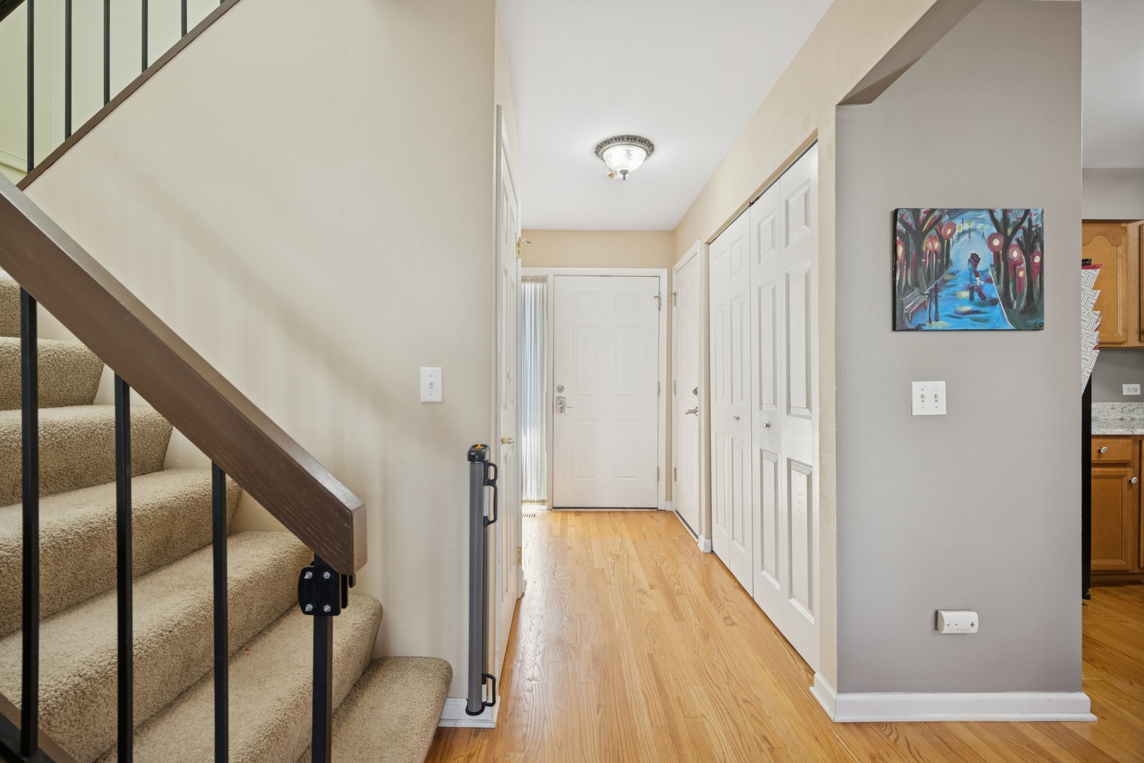 2618 Smith Street Rolling Meadows, IL 60008 - Photo 5 of 27 a view of a hallway with wooden floor and staircase