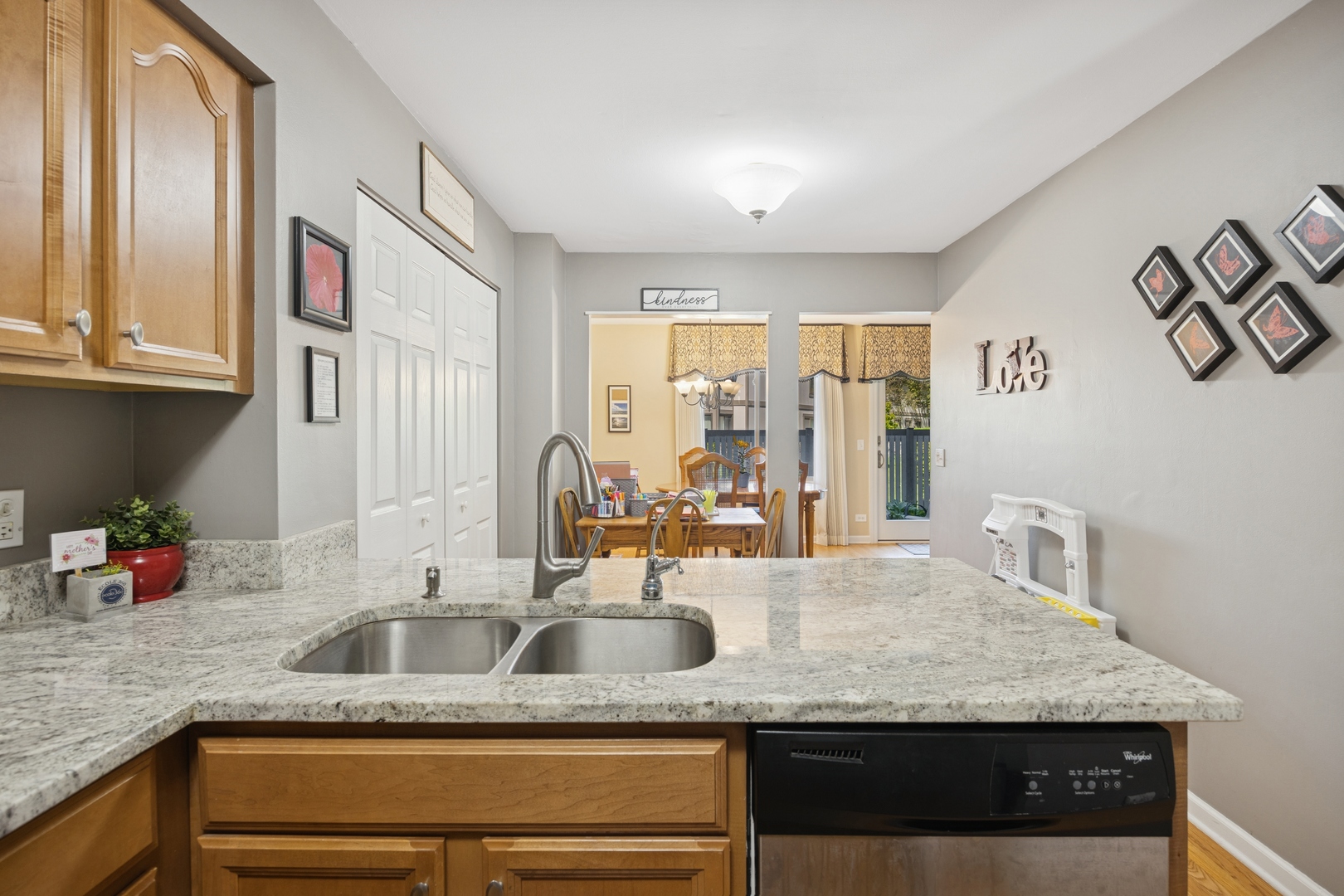 2618 Smith Street Rolling Meadows, IL 60008 - Photo 9 of 27 a kitchen with granite countertop a sink and a refrigerator