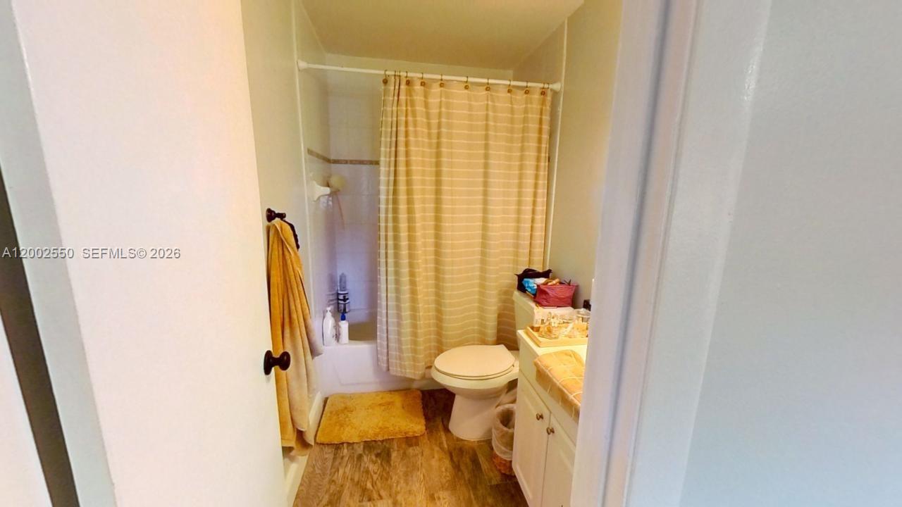 13731 Southwest 84th Street, Unit C11 Miami, FL 33143 - Photo 27 of 32 a bathroom with a sink and a toilet
