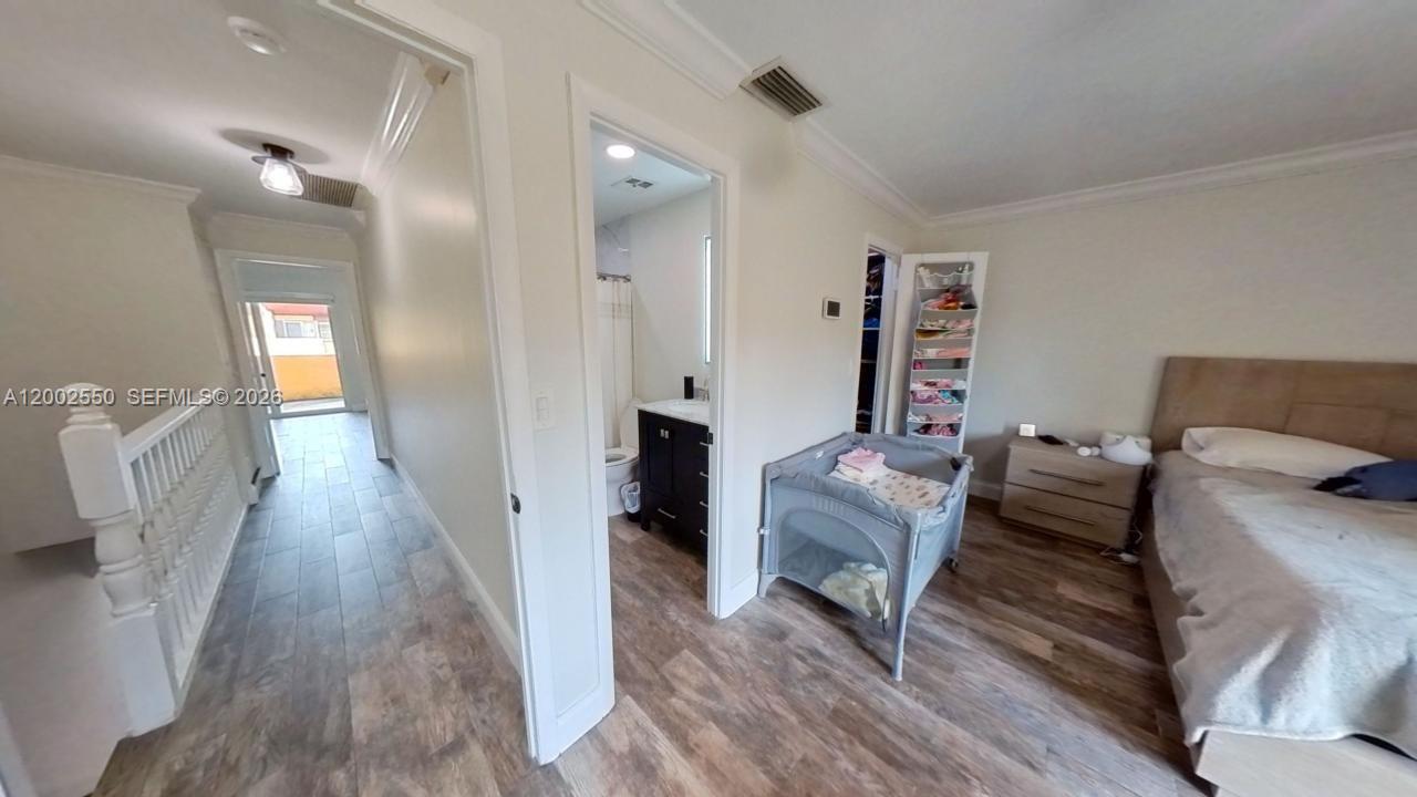 13731 Southwest 84th Street, Unit C11 Miami, FL 33143 - Photo 29 of 32 a living room with furniture and a wooden floor