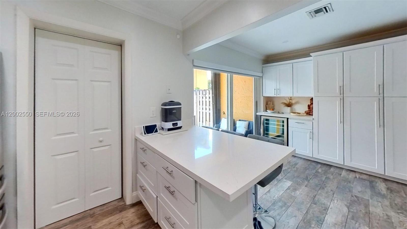 13731 Southwest 84th Street, Unit C11 Miami, FL 33143 - Photo 9 of 32 a kitchen with a sink a stove and cabinets