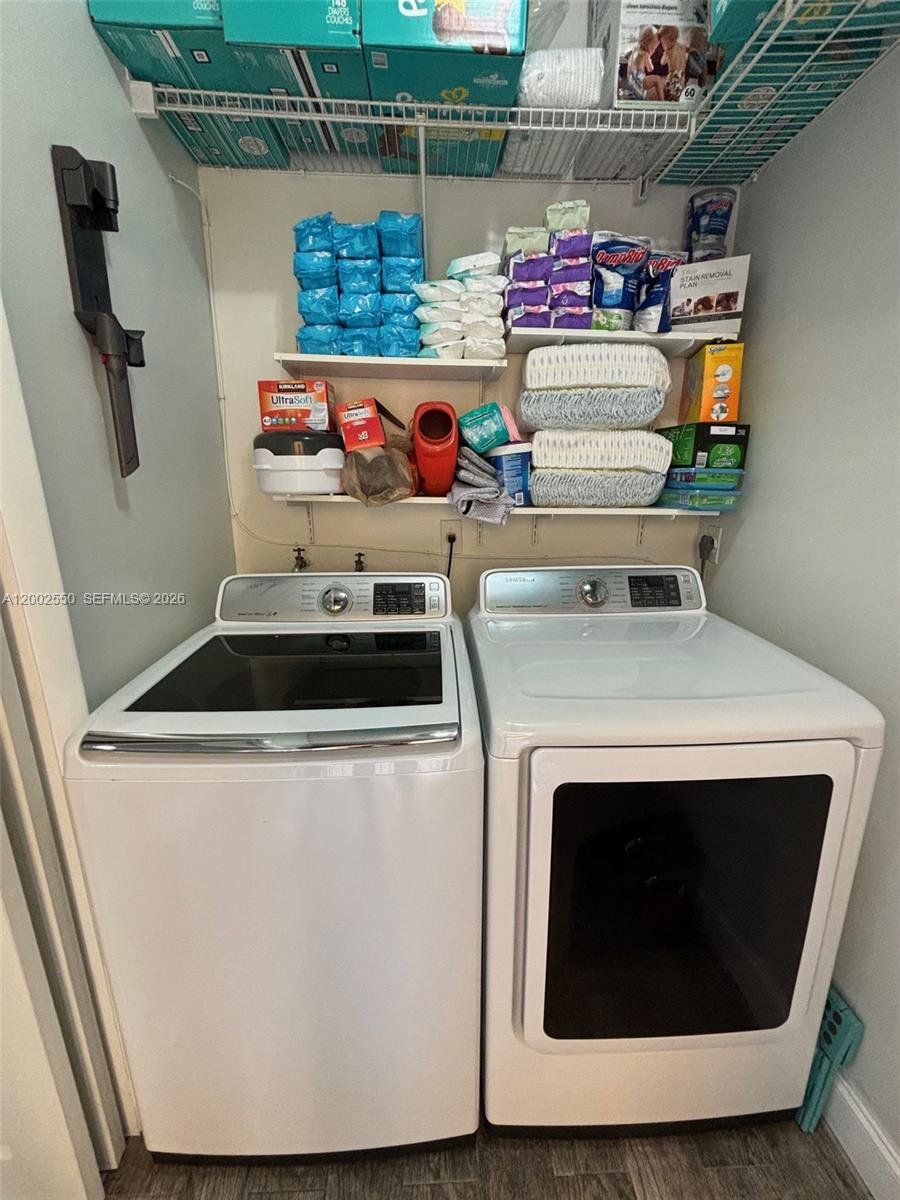 13731 Southwest 84th Street, Unit C11 Miami, FL 33143 - Photo 10 of 32 a utility room with stainless steel appliances washer and dryer