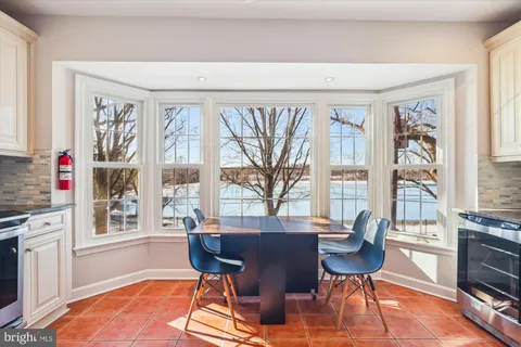 a view of a dining room with furniture window and outside view