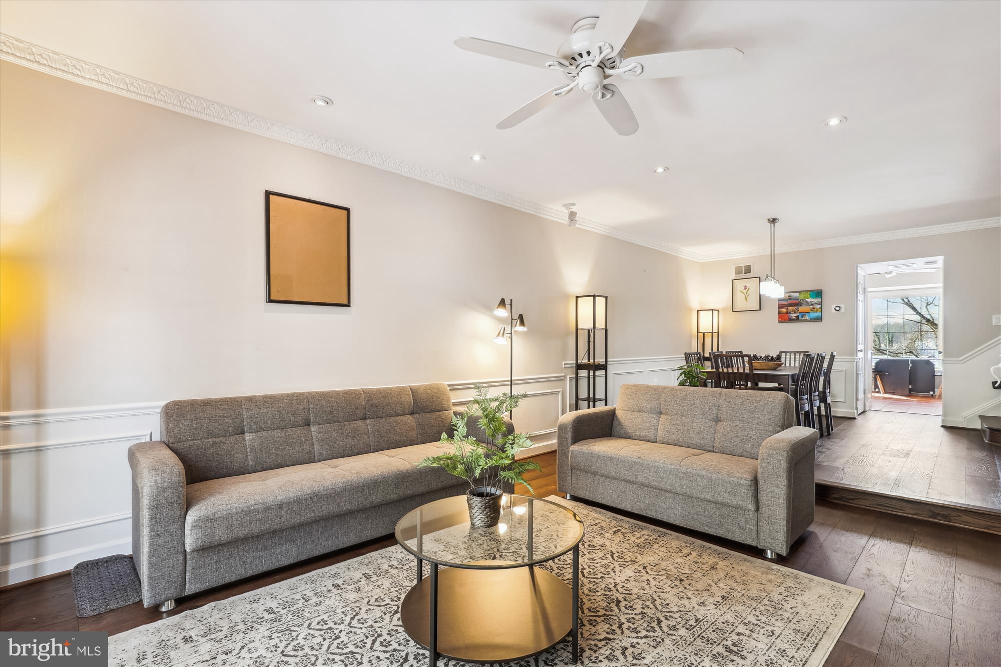 4611 1/2 MacArthur Boulevard Northwest, Unit B Washington, DC 20007 - Photo 18 of 43 a living room with furniture and a chandelier