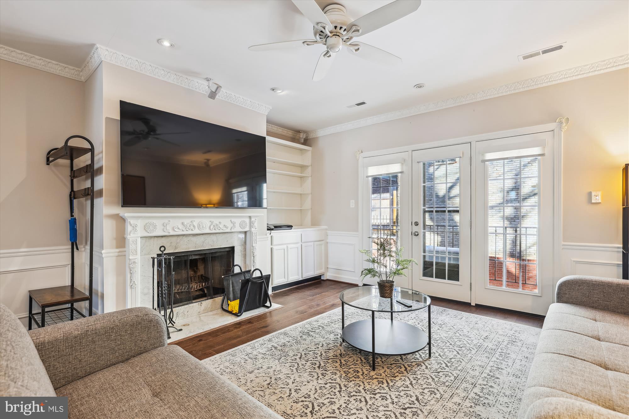 4611 1/2 MacArthur Boulevard Northwest, Unit B Washington, DC 20007 - Photo 20 of 43 a living room with furniture a flat screen tv and a fireplace