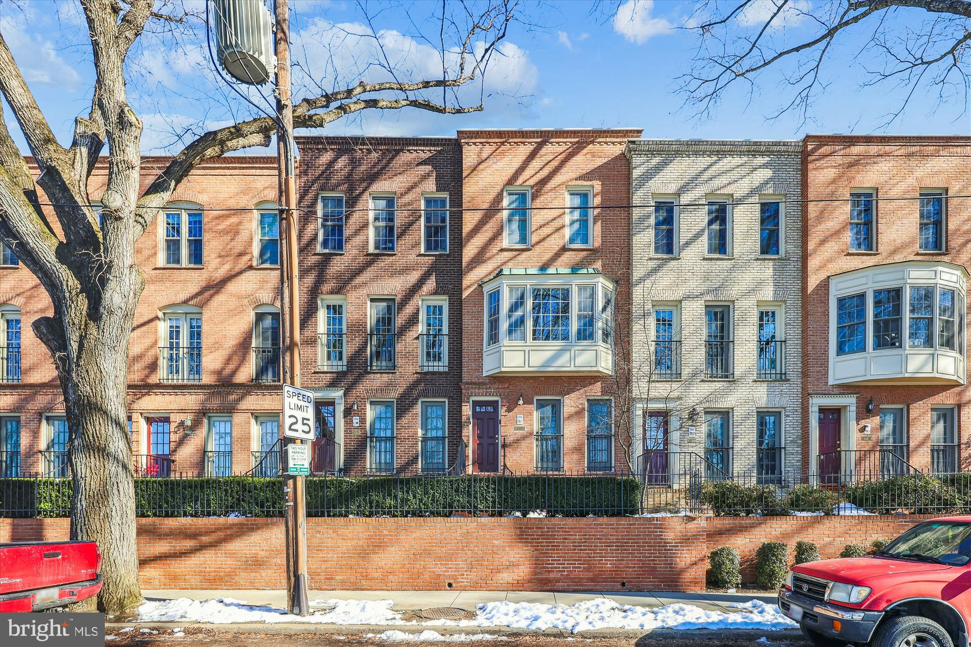 4611 1/2 MacArthur Boulevard Northwest, Unit B Washington, DC 20007 - Photo 2 of 43 a front view of a building with garden