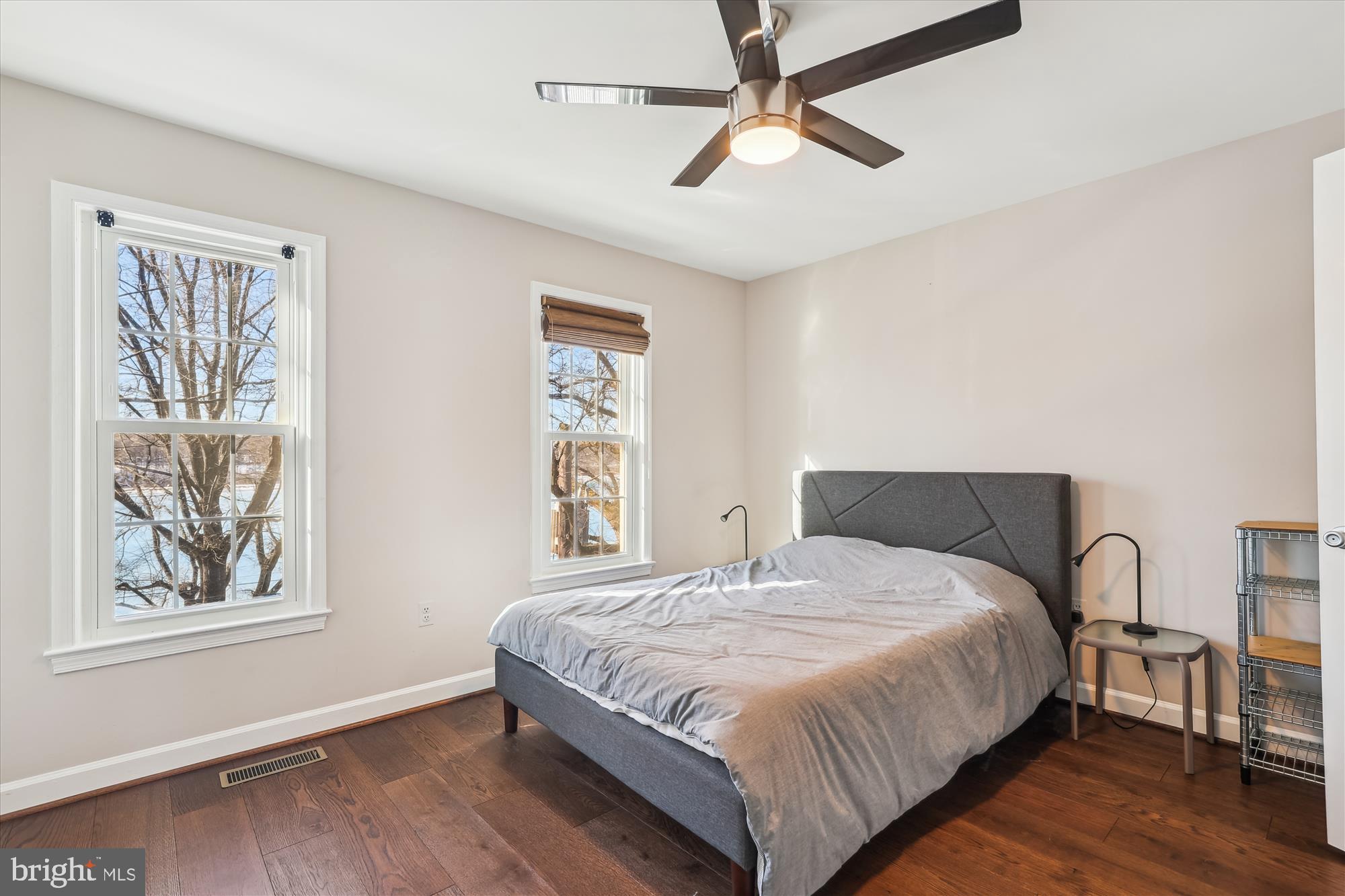 4611 1/2 MacArthur Boulevard Northwest, Unit B Washington, DC 20007 - Photo 22 of 43 a bedroom with a large bed chandelier and a window
