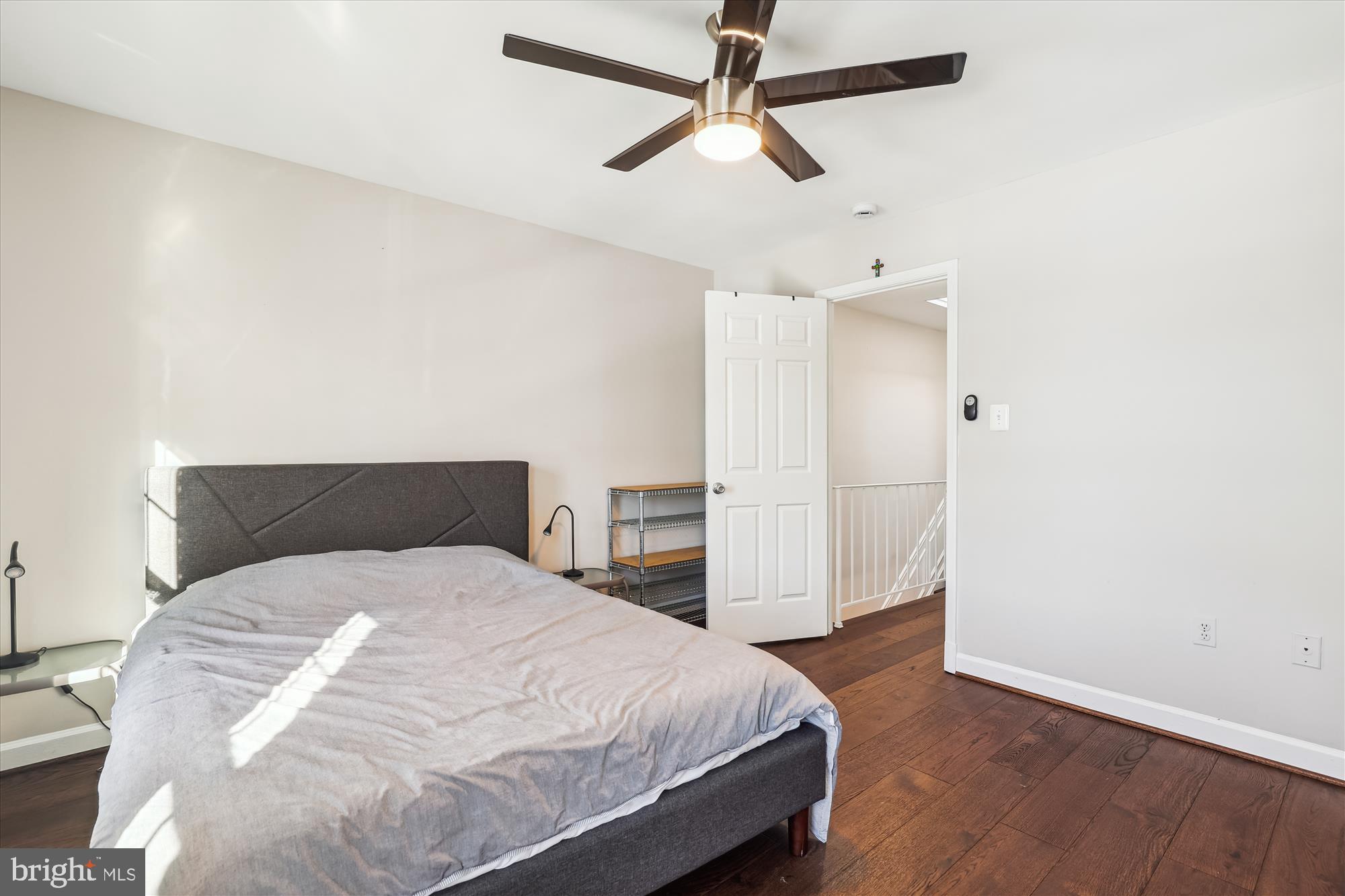 4611 1/2 MacArthur Boulevard Northwest, Unit B Washington, DC 20007 - Photo 23 of 43 a bedroom with a bed and a ceiling fan
