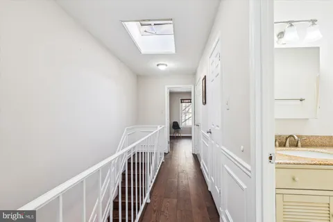 a view of a hallway with a bathtub